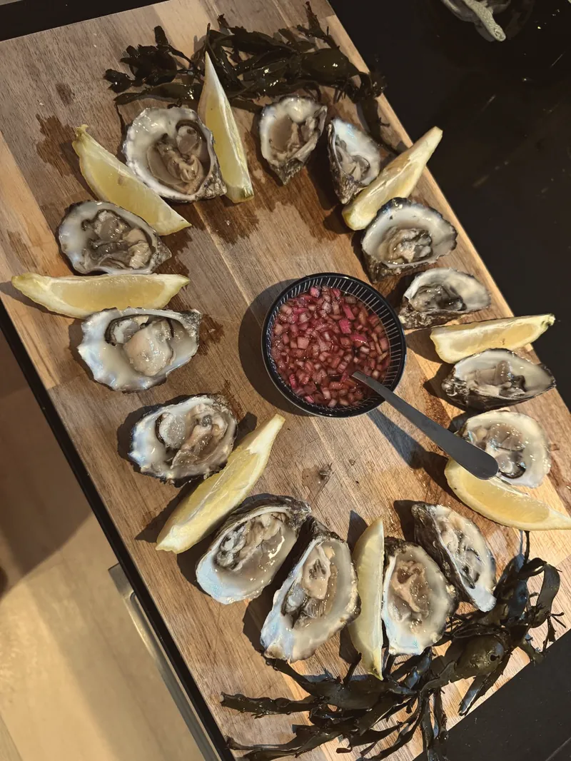 Oesters met citroen als hapje bij de wijn